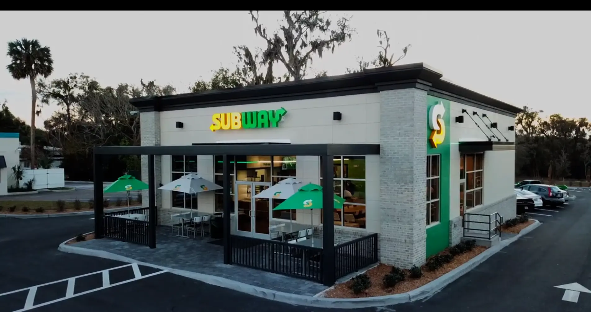 Exterior of the DeLand Subway restaurant with covered patio seating