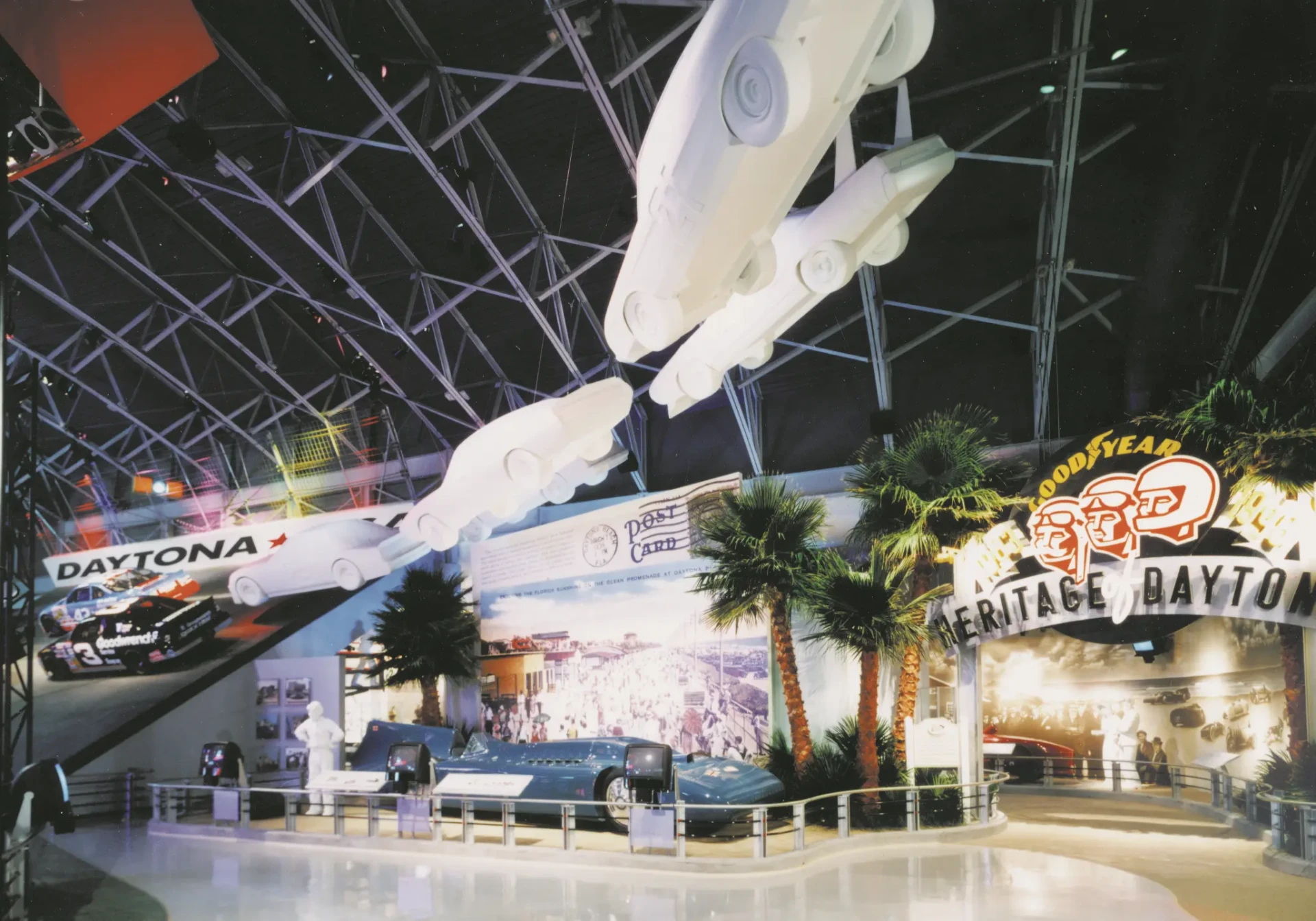 Heritage of Daytona exhibit with suspended stock car sculptures