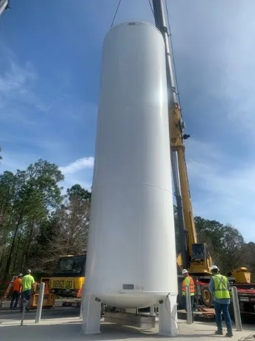 Large industrial pressure tank being set by crane at the ERAU Wind Tunnel Facility