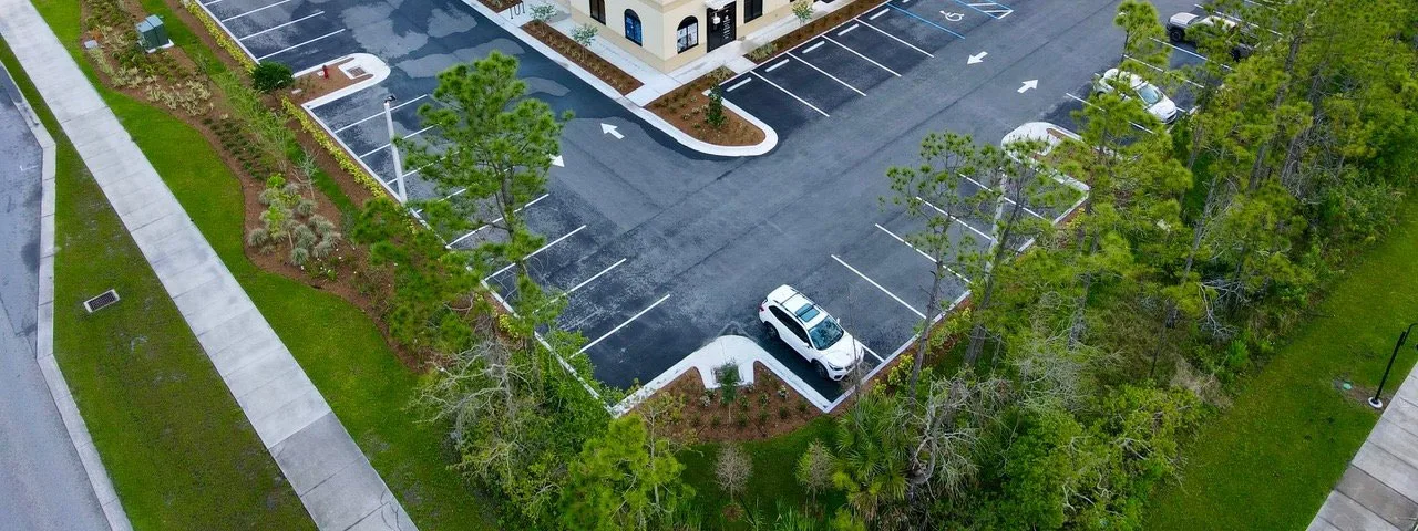 Aerial view of a completed site development and parking field