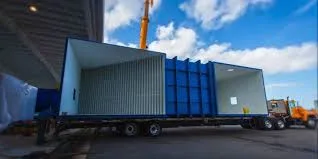 Wind tunnel section arriving on a flatbed trailer during construction